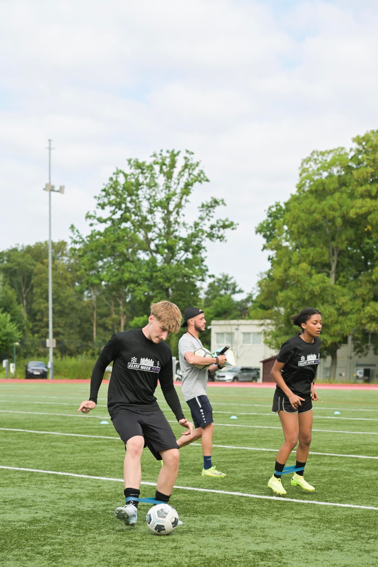 Band-resisted ball work on the turf