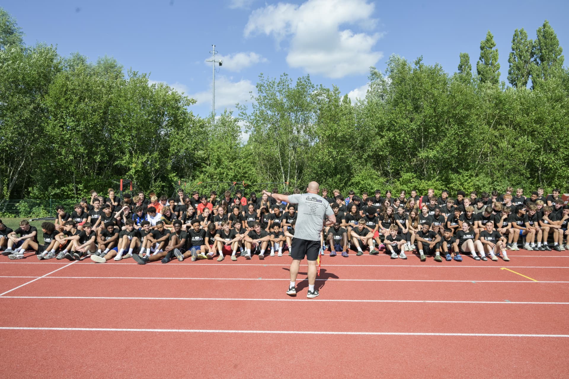 Full Elite Week camp gathered on the track