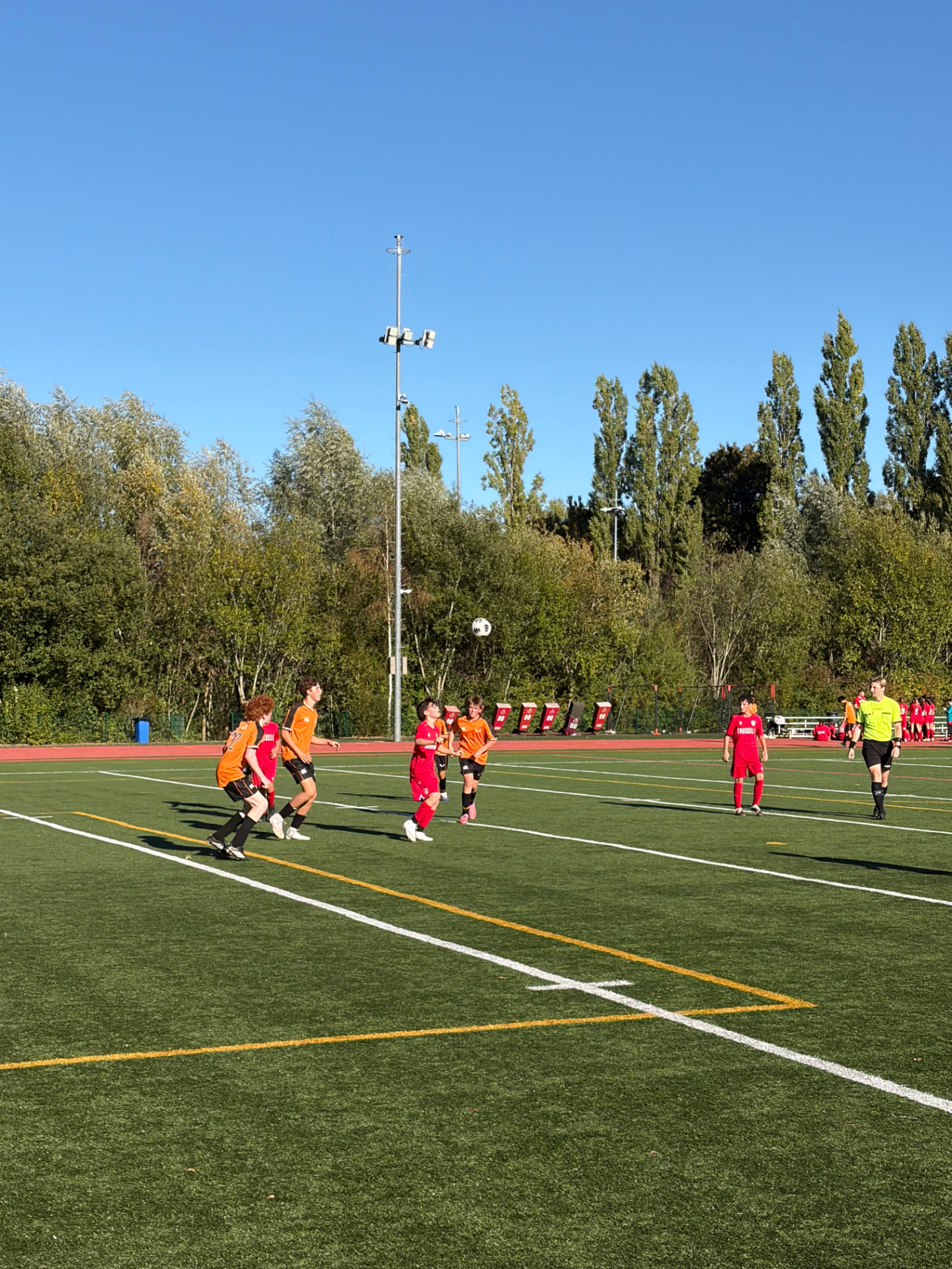 U14 soccer players battling for the ball