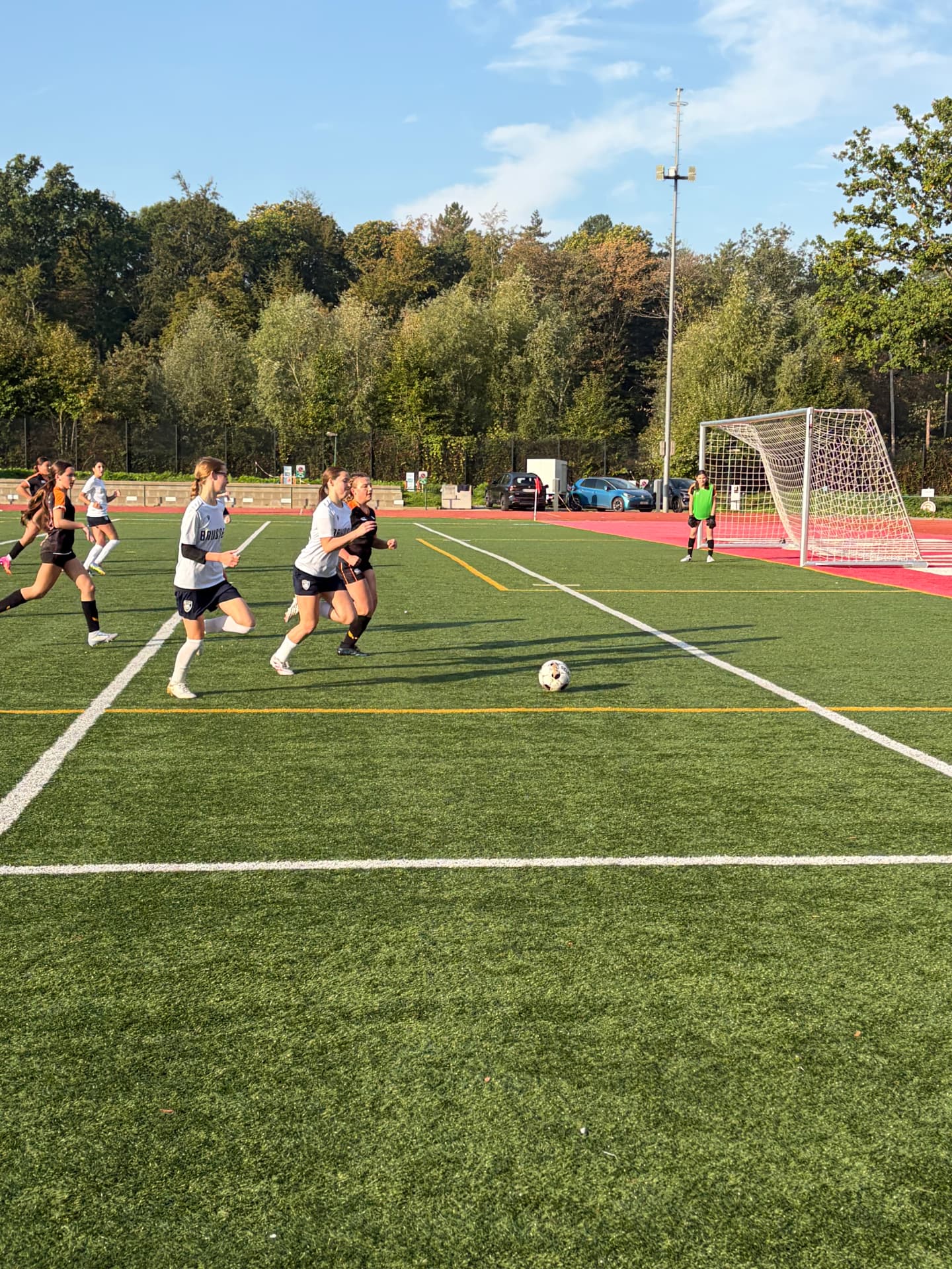 U14 soccer player striking the ball