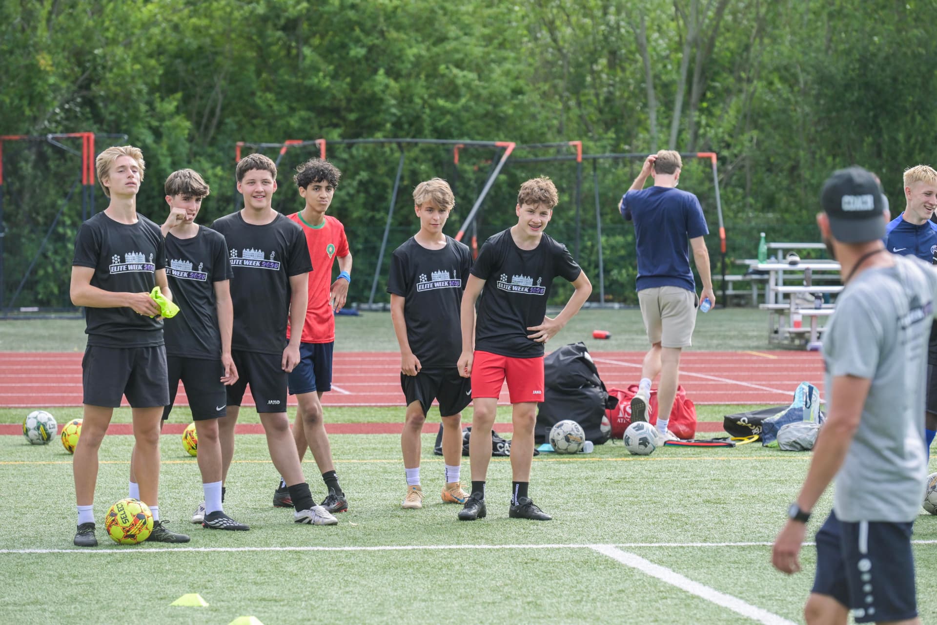 Boys squad listening in between reps